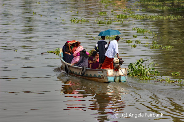 family travelling in boat