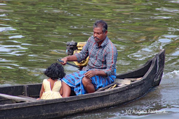 man and girl in boat