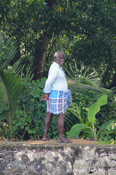 man standing and turning to look at us