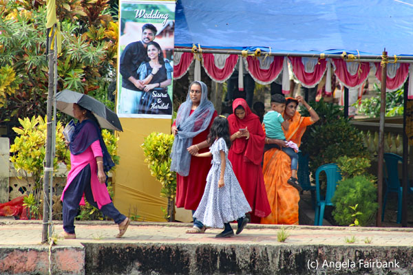 women and children coming out of wedding