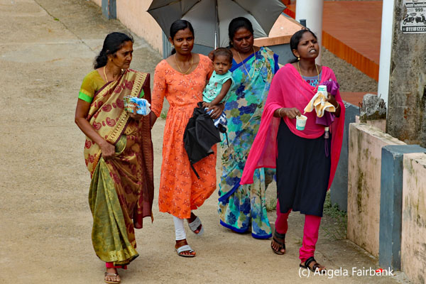 4 women and baby walking