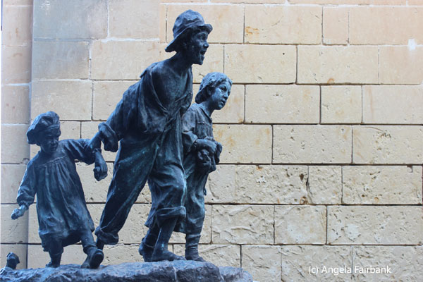 statue of children in gardens