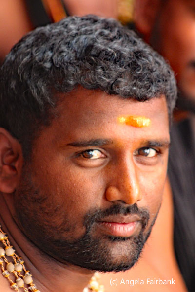 man with yellow tika