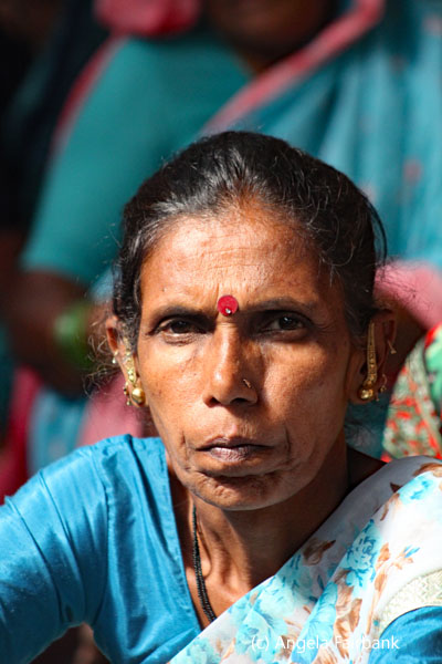 woman in blue not smiling