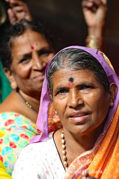 woman with black tika smiling
