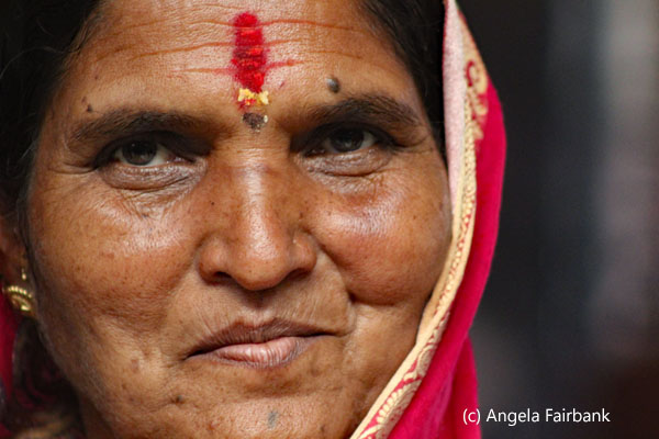 woman in red smiling