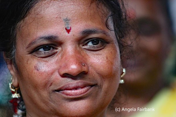 woman smling but looking away