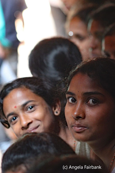 two girls looking in group of 7
