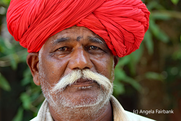 man in red turban