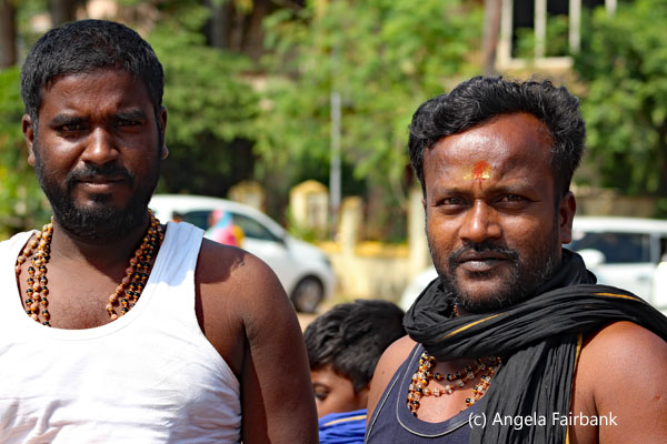 2 men in parking area