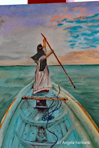 painting of man in boat