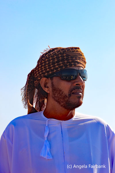 driver in brown head scarf