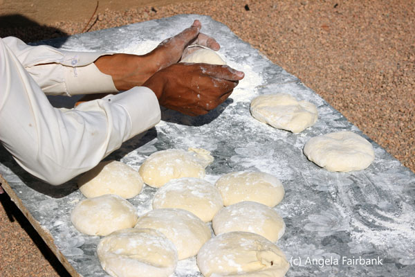 boy shaping bread dough