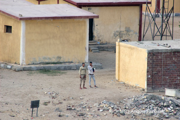 two soldiers outside house